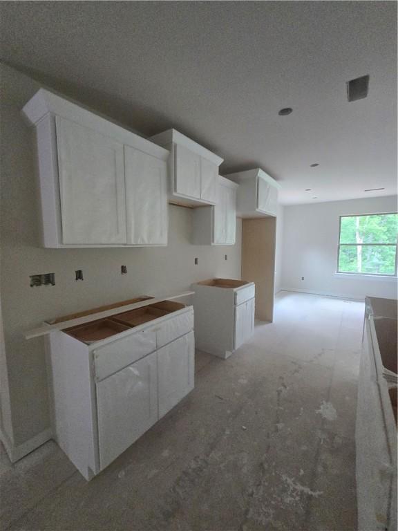 7 Julletta Cir, Bella Vista, AR 72715 - kitchen featuring white cabinetry