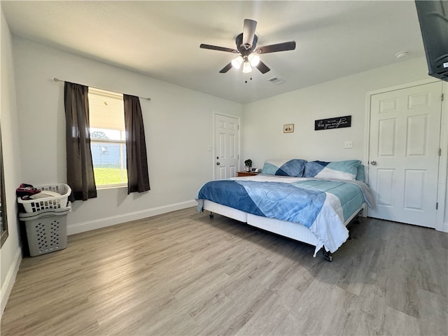 1105 Gibson St, Ozark, AR 72949 - bedroom featuring light wood-type flooring, baseboards, and ceiling fan