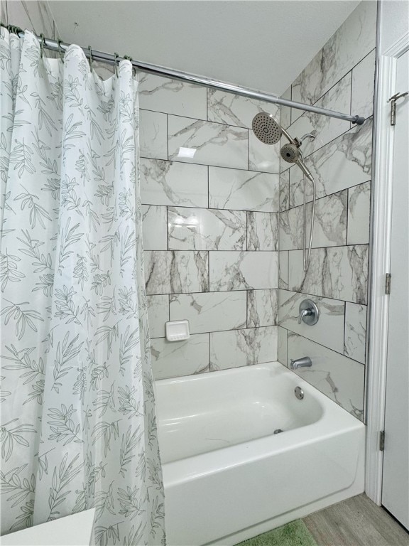 1105 Gibson St, Ozark, AR 72949 - full bath with shower / bathtub combination with curtain and wood finished floors