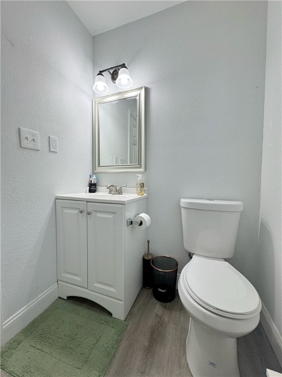 1105 Gibson St, Ozark, AR 72949 - half bath featuring wood finished floors, vanity, and toilet