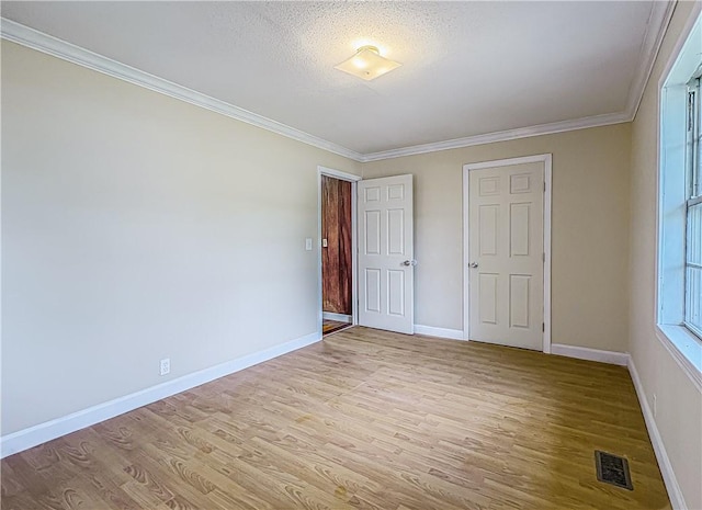 403 N Arch Ave, Green Forest, AR 72638 - unfurnished bedroom with wood finished floors, baseboards, crown molding, and a textured ceiling