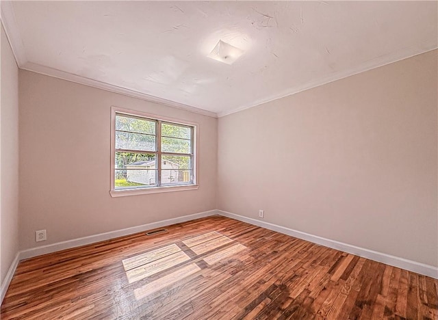 403 N Arch Ave, Green Forest, AR 72638 - empty room with crown molding, wood finished floors, and baseboards