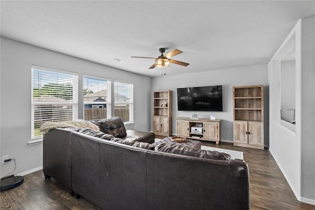 904 SW Loudon Dr, Bentonville, AR 72712 - living room featuring a ceiling fan, dark wood-style floors, and baseboards