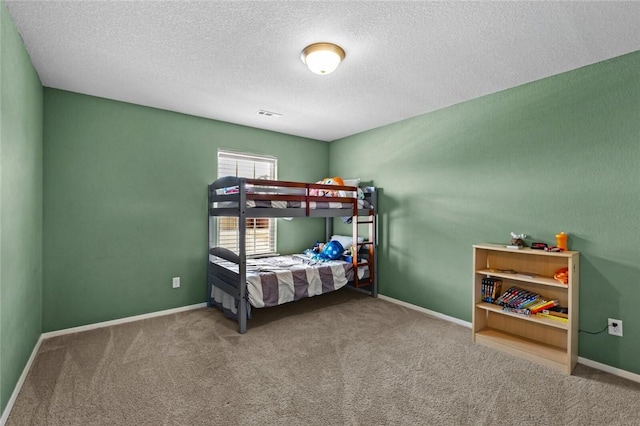 904 SW Loudon Dr, Bentonville, AR 72712 - carpeted bedroom featuring a textured ceiling and baseboards