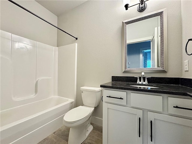 903 NE Heights Ln, Bentonville, AR 72712 - bathroom featuring vanity, toilet, shower / tub combination, and baseboards