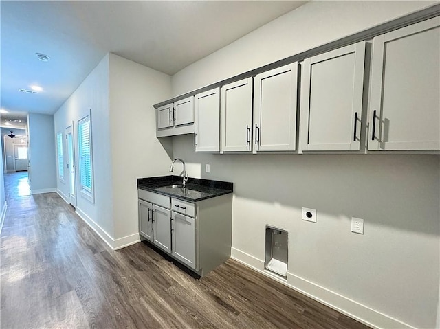 903 NE Heights Ln, Bentonville, AR 72712 - washroom featuring electric dryer hookup, dark wood-style floors, baseboards, cabinet space, and recessed lighting