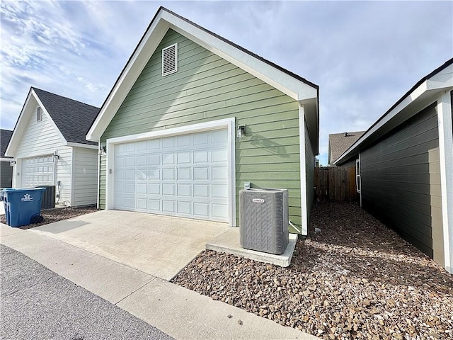 903 NE Heights Ln, Bentonville, AR 72712 - garage with central air condition unit and concrete driveway
