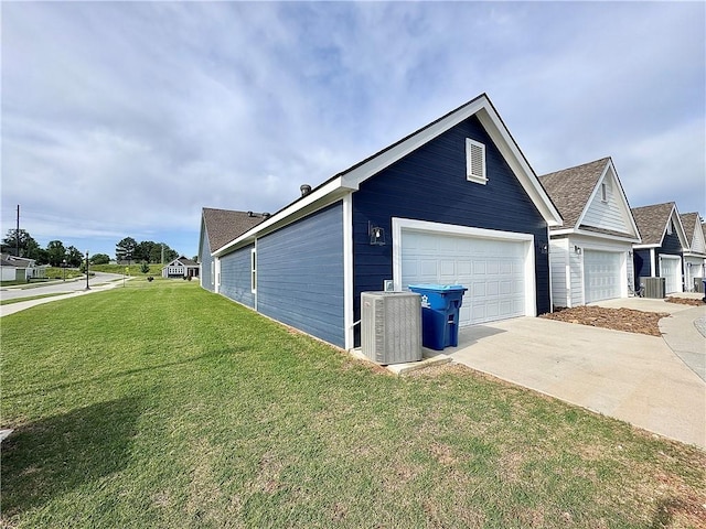 837 NE Heights Ln, Bentonville, AR 72712 - view of side of property with central air condition unit, a garage, a yard, and concrete driveway