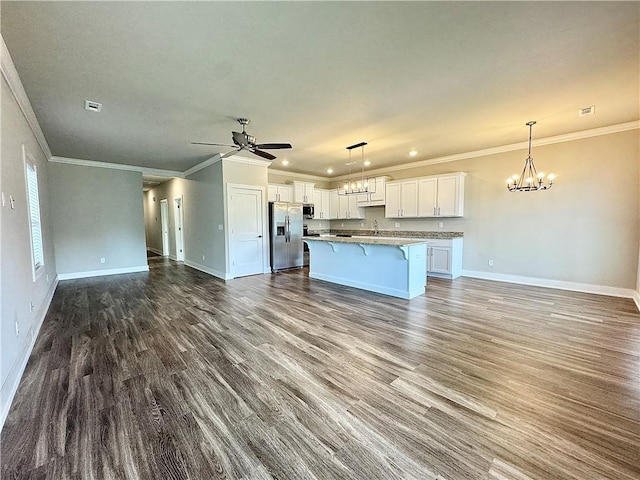 837 NE Heights Ln, Bentonville, AR 72712 - unfurnished living room featuring a chandelier, baseboards, ornamental molding, a ceiling fan, and dark wood finished floors