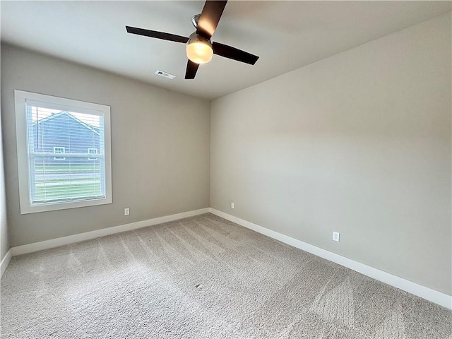 837 NE Heights Ln, Bentonville, AR 72712 - spare room featuring baseboards, light carpet, and a ceiling fan
