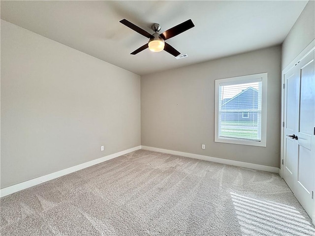 837 NE Heights Ln, Bentonville, AR 72712 - unfurnished room with ceiling fan, baseboards, and light carpet