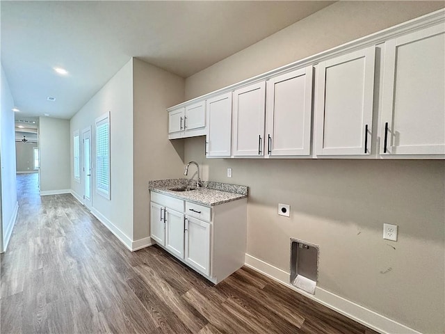 837 NE Heights Ln, Bentonville, AR 72712 - washroom with hookup for an electric dryer, baseboards, dark wood-style flooring, cabinet space, and recessed lighting