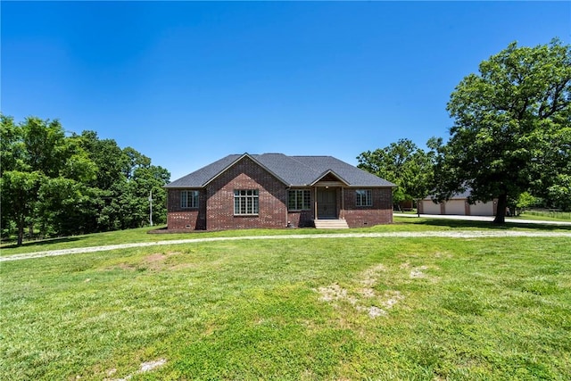 15071 Crossover Rd, Gravette, AR 72736 - single story home with brick siding, a front lawn, an outdoor structure, and a detached garage