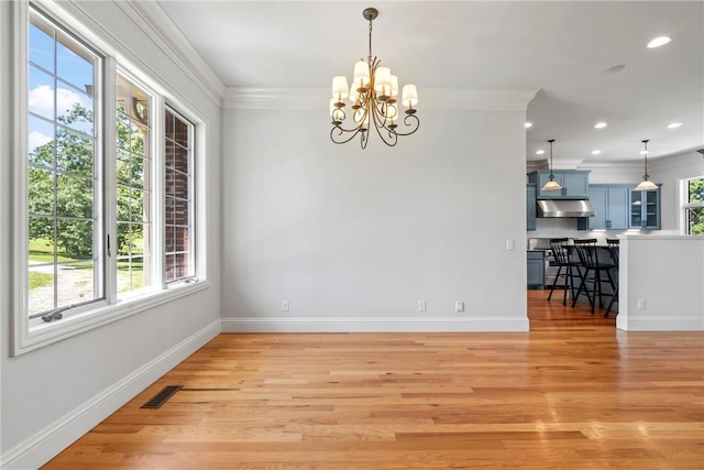 15071 Crossover Rd, Gravette, AR 72736 - unfurnished dining area with ornamental molding, light wood-style floors, a chandelier, baseboards, and recessed lighting