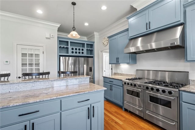 15071 Crossover Rd, Gravette, AR 72736 - kitchen featuring appliances with stainless steel finishes, under cabinet range hood, blue cabinets, ornamental molding, and decorative light fixtures