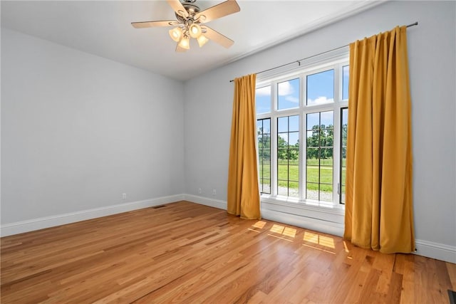 15071 Crossover Rd, Gravette, AR 72736 - unfurnished room featuring light wood-type flooring, baseboards, and ceiling fan