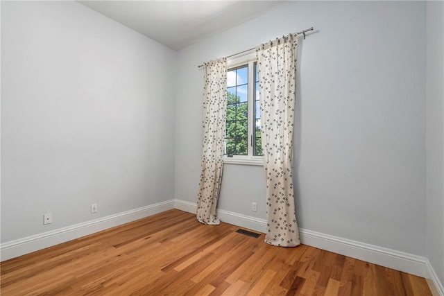 15071 Crossover Rd, Gravette, AR 72736 - unfurnished room featuring baseboards and light wood-style flooring