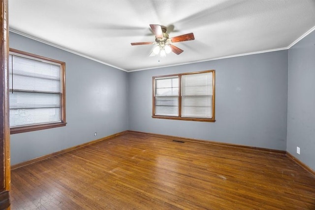 713 Young St, Springdale, AR 72764 - spare room with hardwood / wood-style flooring, ceiling fan, crown molding, and baseboards