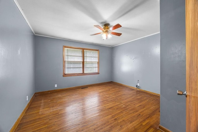 713 Young St, Springdale, AR 72764 - spare room with ceiling fan, ornamental molding, wood finished floors, and baseboards