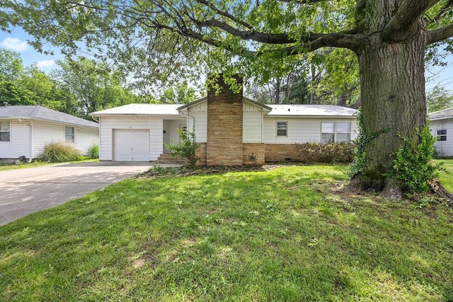 713 Young St, Springdale, AR 72764 - view of front of home with a chimney, a garage, a front lawn, and driveway