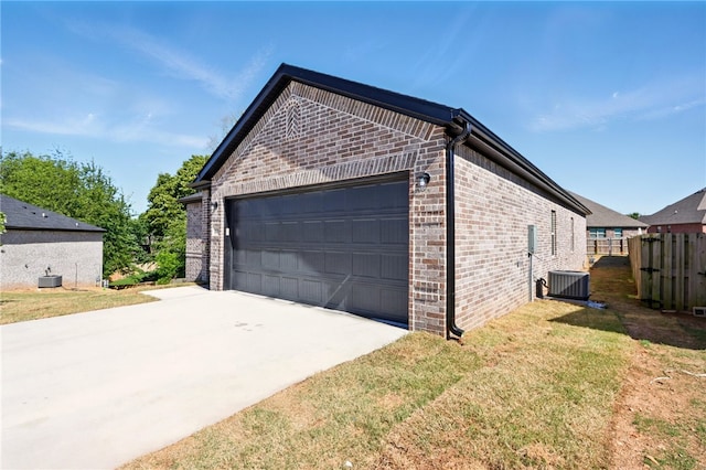 4545 Gibson St, Springdale, AR 72762 - view of home's exterior with brick siding, cooling unit, an attached garage, and concrete driveway
