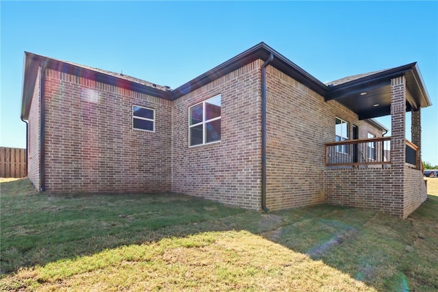 4545 Gibson St, Springdale, AR 72762 - view of side of home featuring brick siding and a yard