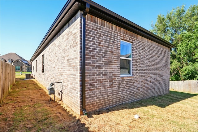 4545 Gibson St, Springdale, AR 72762 - view of home's exterior with cooling unit and brick siding