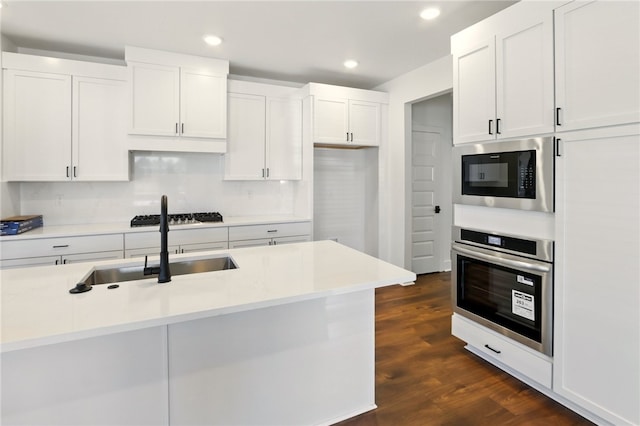 4545 Gibson St, Springdale, AR 72762 - kitchen with appliances with stainless steel finishes, a sink, white cabinets, recessed lighting, and dark wood finished floors