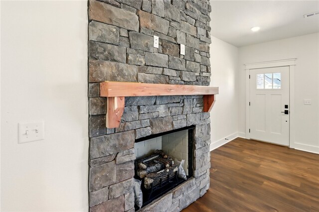 4545 Gibson St, Springdale, AR 72762 - foyer entrance with a stone fireplace, wood finished floors, and baseboards