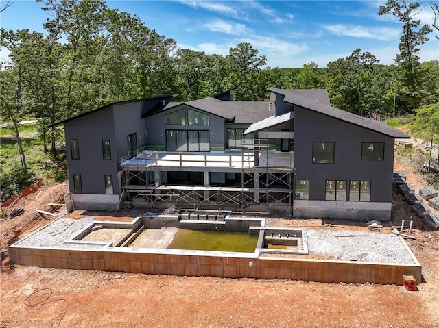 15903 Hawks Landing Dr, Rogers, AR 72756 - back of house featuring stucco siding and a wooden deck