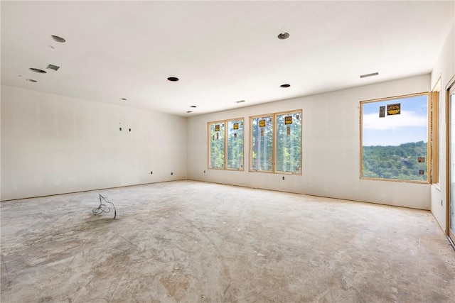 15903 Hawks Landing Dr, Rogers, AR 72756 - empty room featuring unfinished concrete flooring and recessed lighting
