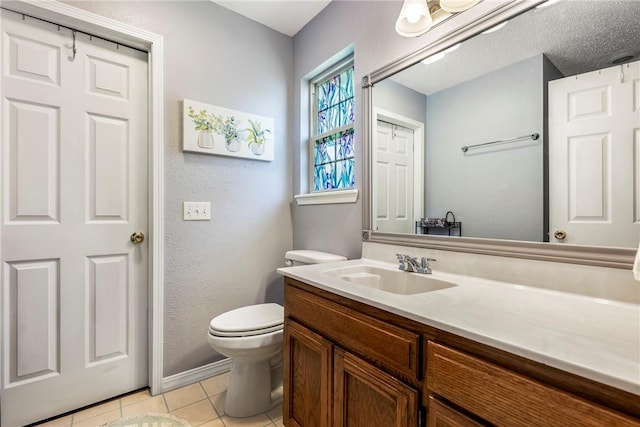 14 Jordan Ln, Bentonville, AR 72712 - bathroom with vanity, tile patterned floors, toilet, baseboards, and a textured wall
