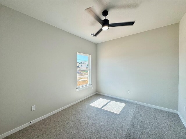 6002 SW Desert Ave, Bentonville, AR 72713 - carpeted spare room with a ceiling fan and baseboards