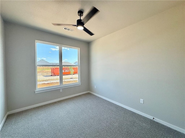 6002 SW Desert Ave, Bentonville, AR 72713 - empty room featuring ceiling fan and carpet floors