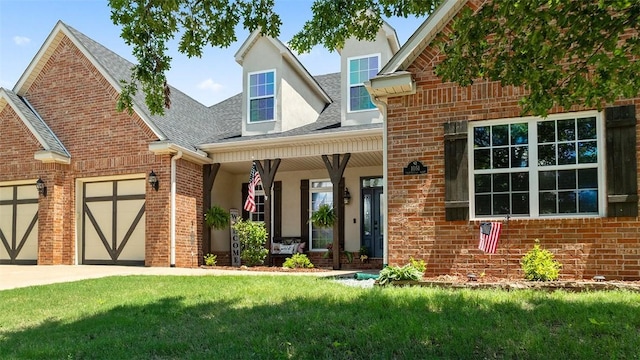1051 Thornridge Rd, Bentonville, AR 72713 - traditional home featuring covered porch, brick siding, a front yard, an attached garage, and roof with shingles