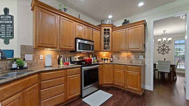 1051 Thornridge Rd, Bentonville, AR 72713 - kitchen with stainless steel appliances, a sink, ornamental molding, dark wood finished floors, and a chandelier
