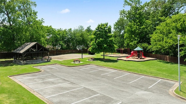 1051 Thornridge Rd, Bentonville, AR 72713 - view of community with a gazebo, uncovered parking, view of wooded area, and community basketball court