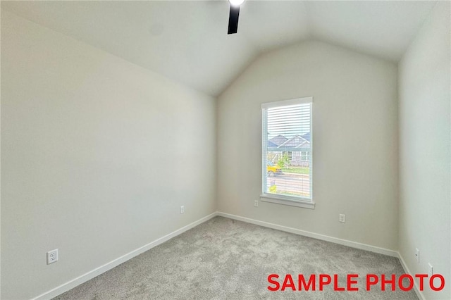 5902 SW Desert Ave, Bentonville, AR 72713 - carpeted spare room with ceiling fan, vaulted ceiling, and baseboards