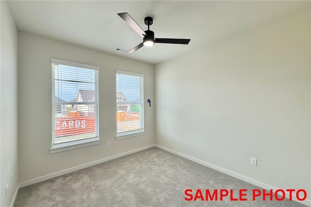 5902 SW Desert Ave, Bentonville, AR 72713 - carpeted spare room featuring ceiling fan and baseboards