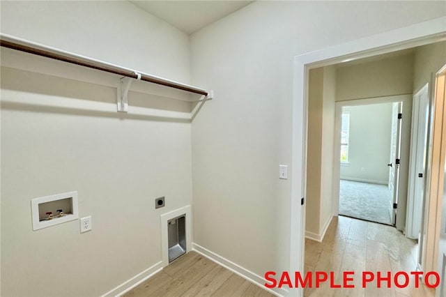 5902 SW Desert Ave, Bentonville, AR 72713 - washroom featuring washer hookup, light wood-type flooring, baseboards, and hookup for an electric dryer