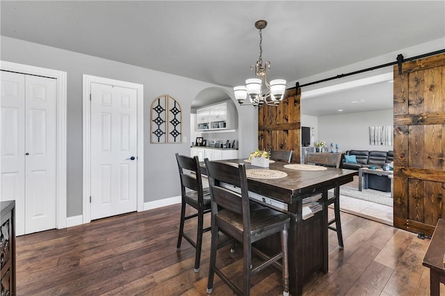 1630 S Dixieland Rd, Rogers, AR 72758 - dining space featuring a barn door, dark wood finished floors, a chandelier, and baseboards