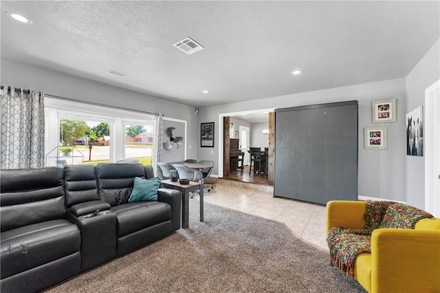 1630 S Dixieland Rd, Rogers, AR 72758 - living area with light tile patterned flooring, recessed lighting, light carpet, and a textured ceiling