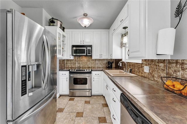1630 S Dixieland Rd, Rogers, AR 72758 - kitchen featuring appliances with stainless steel finishes, a sink, and white cabinetry