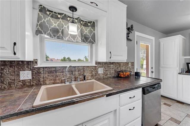 1630 S Dixieland Rd, Rogers, AR 72758 - kitchen with stainless steel dishwasher, a sink, tasteful backsplash, and white cabinetry