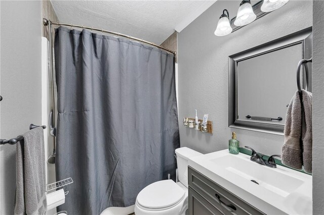 1630 S Dixieland Rd, Rogers, AR 72758 - full bathroom with toilet, vanity, a textured ceiling, and curtained shower
