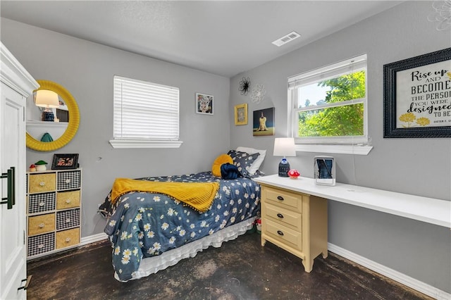 1630 S Dixieland Rd, Rogers, AR 72758 - bedroom featuring concrete flooring and baseboards