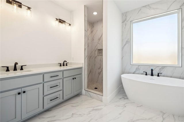 10 Rushden Ln, Bella Vista, AR 72714 - full bathroom featuring marble look tile flooring, a soaking tub, a marble finish shower, double vanity, and recessed lighting