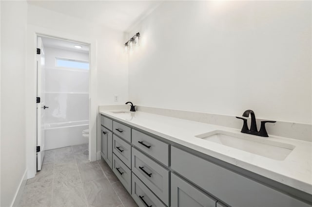 10 Rushden Ln, Bella Vista, AR 72714 - bathroom with double vanity, toilet, a tub to relax in, and marble finish flooring