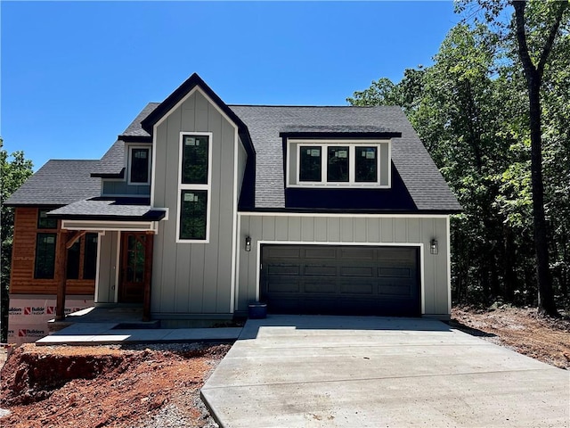 10 Rushden Ln, Bella Vista, AR 72714 - modern farmhouse featuring driveway, a shingled roof, and an attached garage