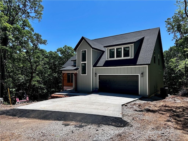 10 Rushden Ln, Bella Vista, AR 72714 - view of front of property with concrete driveway, roof with shingles, and an attached garage